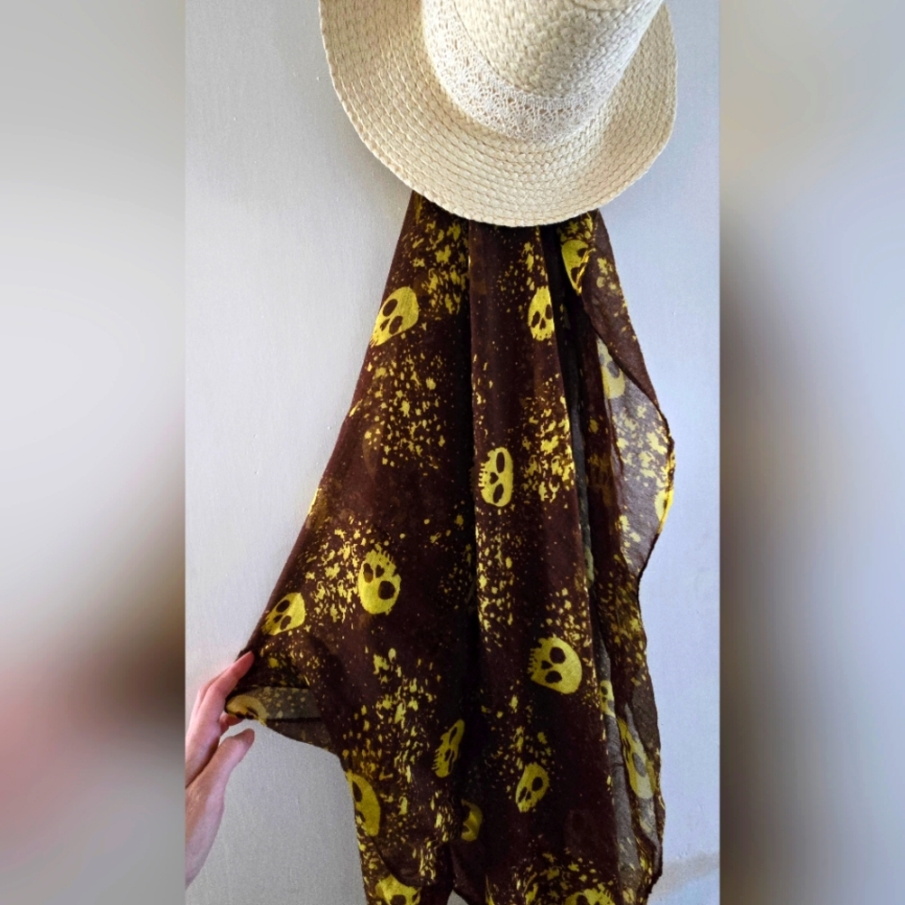 Sheer scarf. Brown with yellow skull print.
